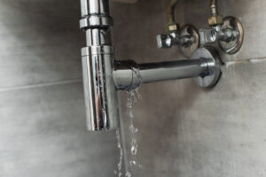 leaky chrome pipe with water damage on wall 2026 03 12 23 52 28 utc