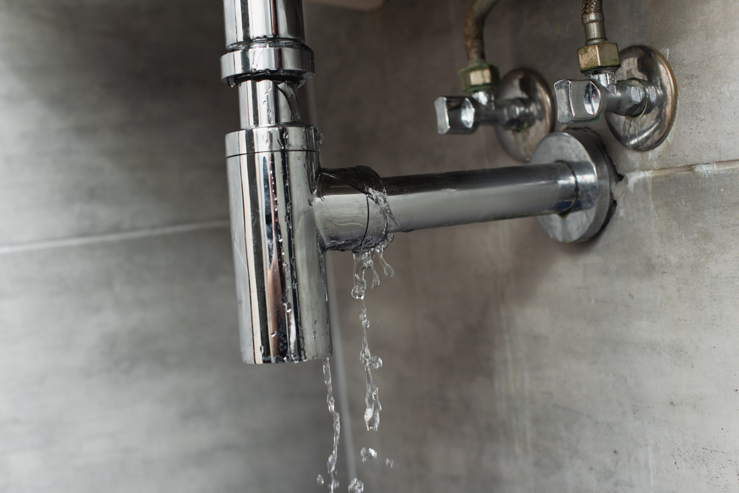 leaky chrome pipe with water damage on wall 2026 03 12 23 52 28 utc